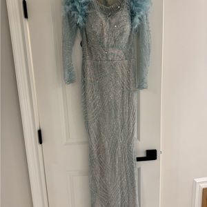 Custom hand sewn sequins and ostrich feather gown